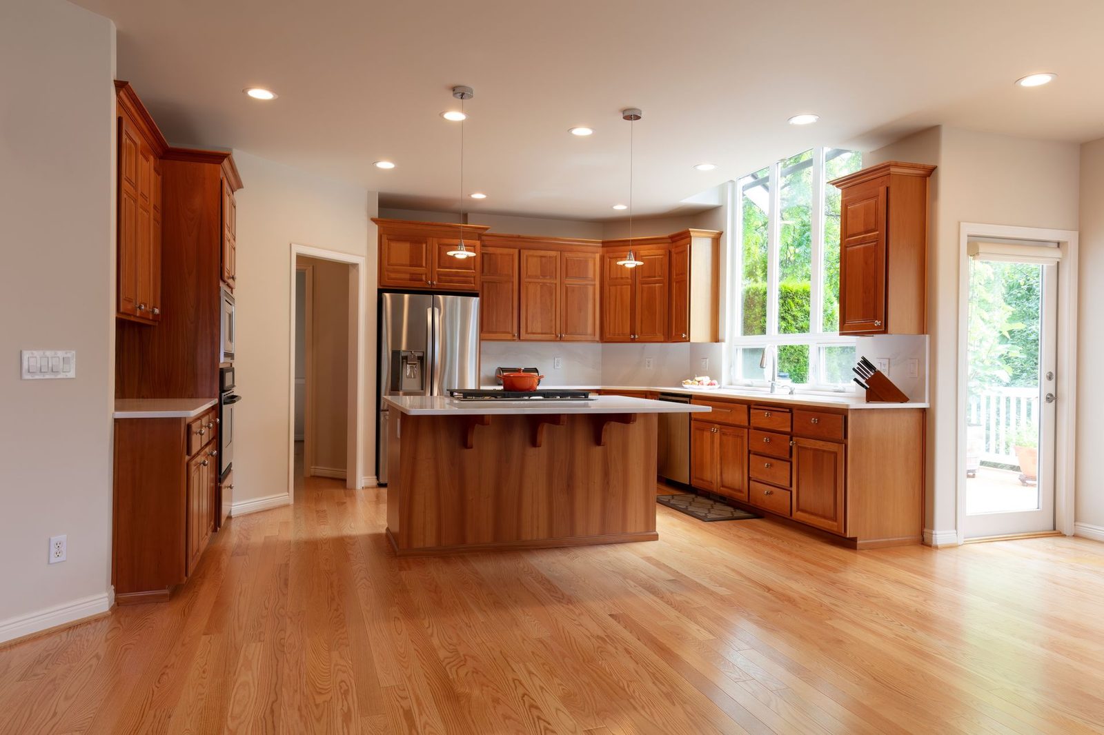 Bright kitchen with natural wood cabinetry